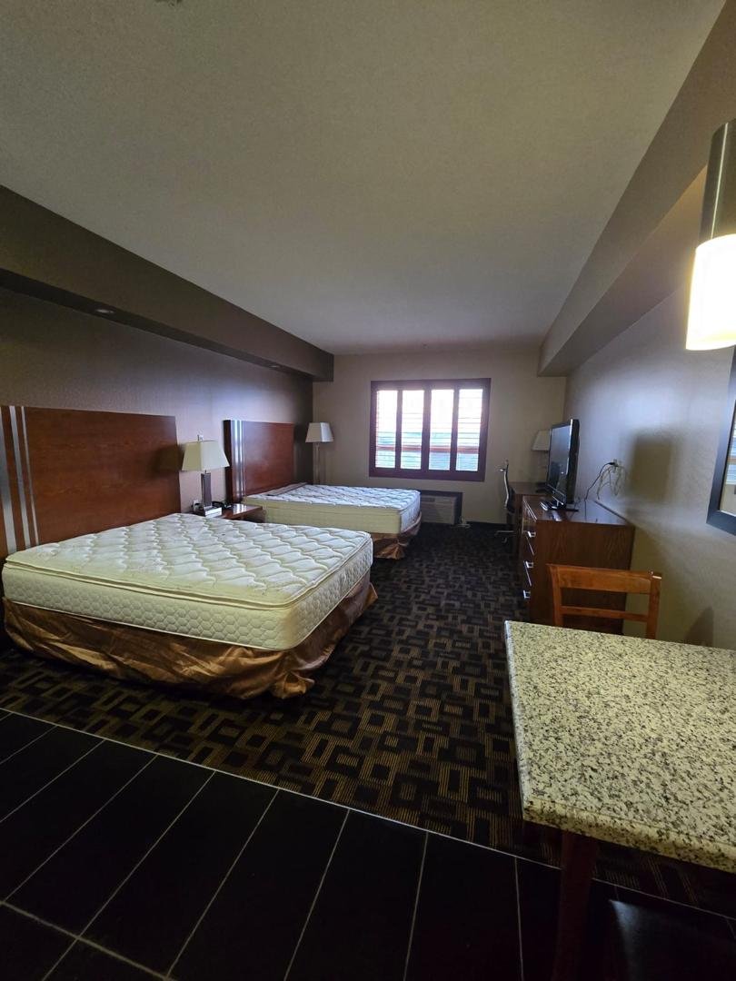 Hotel guest room with two beds after cleaning