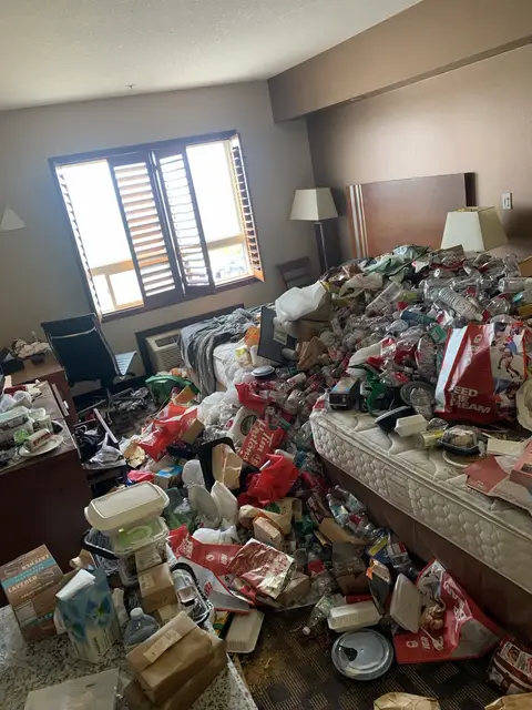 Cluttered hotel room before ELR property reset